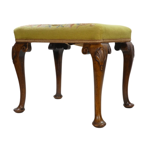 950 - A George II style walnut stool - with rectangular petit point upholstered seat, showing a griffin am... 