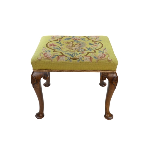 950 - A George II style walnut stool - with rectangular petit point upholstered seat, showing a griffin am... 