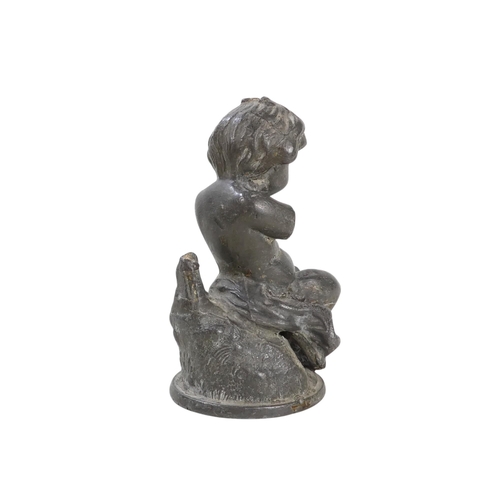 100 - A late 19th century spelter figure of a young boy - holding a bird, 37cm high, together with a small... 