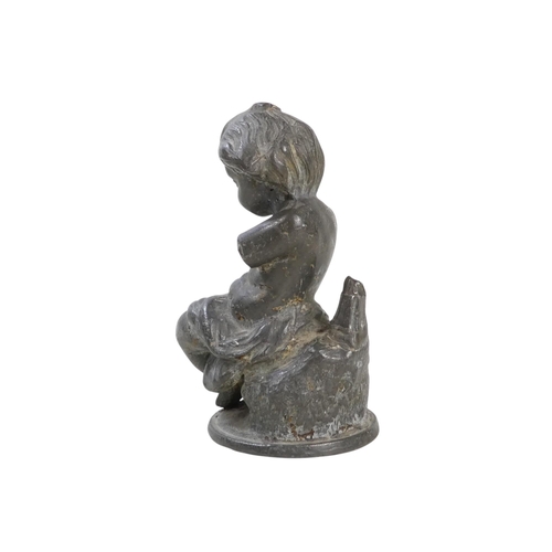 100 - A late 19th century spelter figure of a young boy - holding a bird, 37cm high, together with a small... 