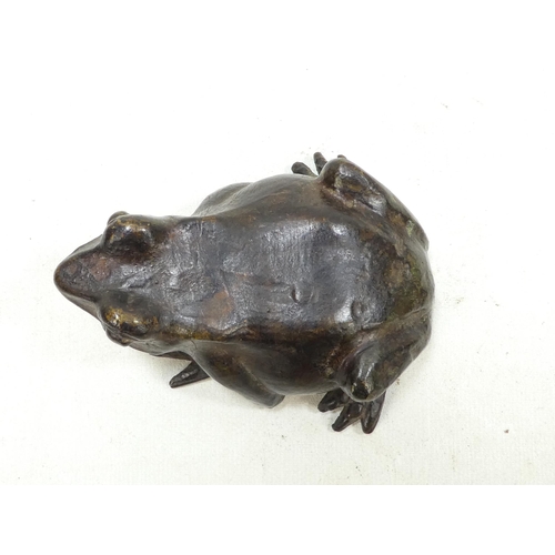 101 - A pair of late 19th century cast bronze frogs - with brown patination, 9cm wide. (2)