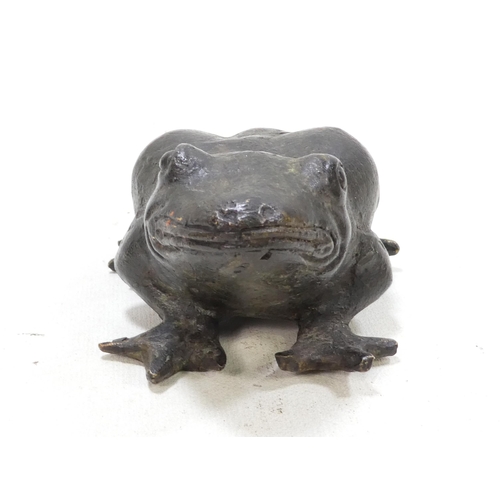 101 - A pair of late 19th century cast bronze frogs - with brown patination, 9cm wide. (2)