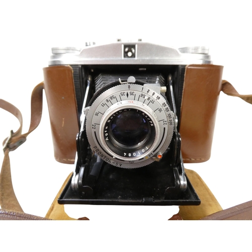 106 - An Agfa 35mm camera - in a brown leather case, together with another earlier example. (2)