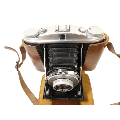 106 - An Agfa 35mm camera - in a brown leather case, together with another earlier example. (2)