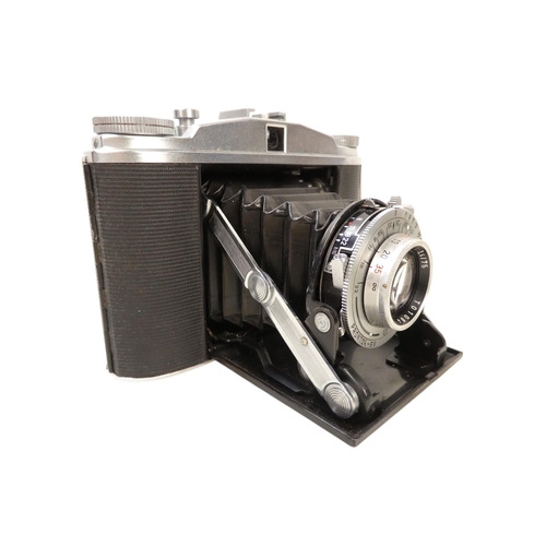 106 - An Agfa 35mm camera - in a brown leather case, together with another earlier example. (2)