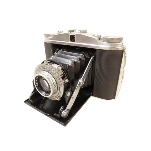 106 - An Agfa 35mm camera - in a brown leather case, together with another earlier example. (2)