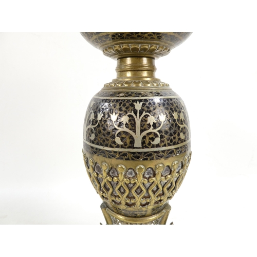 11 - An early 20th century Turkish brass and enamel lamp base - decorated with foliage and flowers on a l... 