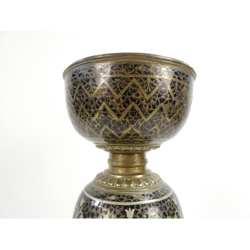 11 - An early 20th century Turkish brass and enamel lamp base - decorated with foliage and flowers on a l... 