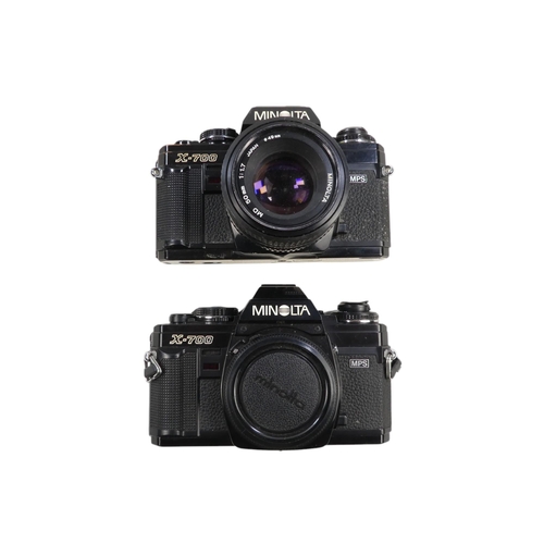 113 - A Minolta X-700 35mm SLR camera body - together with two other similar bodies, an SRT 101 body and s... 