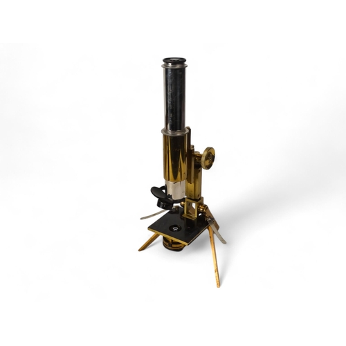 13 - An early 20th century field microscope by J Swift & Son London - lacquered brass with rack-and-pinio... 