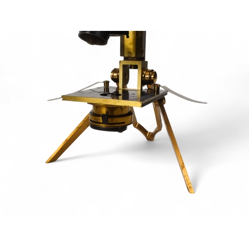 13 - An early 20th century field microscope by J Swift & Son London - lacquered brass with rack-and-pinio... 