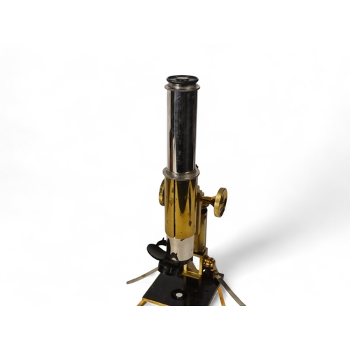 13 - An early 20th century field microscope by J Swift & Son London - lacquered brass with rack-and-pinio... 