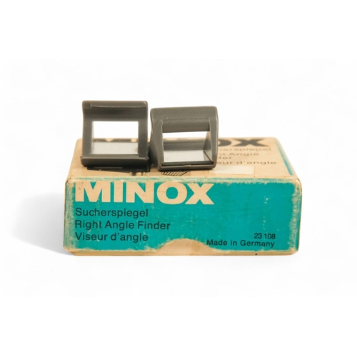 145 - A collection of Minox camera accessories - including camera clamp, viewing magnifier and cutter, lig... 