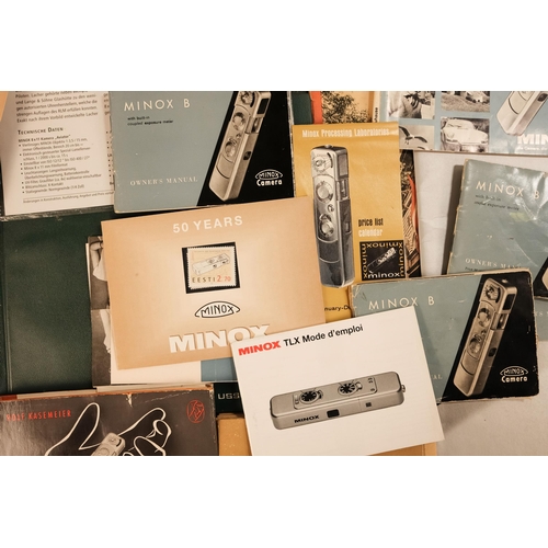 148 - A quantity of Minox ephemera - including two early guide books and two early film sleeves, together ... 