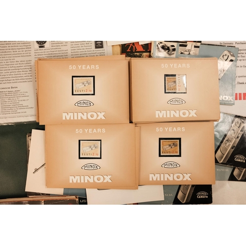 148 - A quantity of Minox ephemera - including two early guide books and two early film sleeves, together ... 