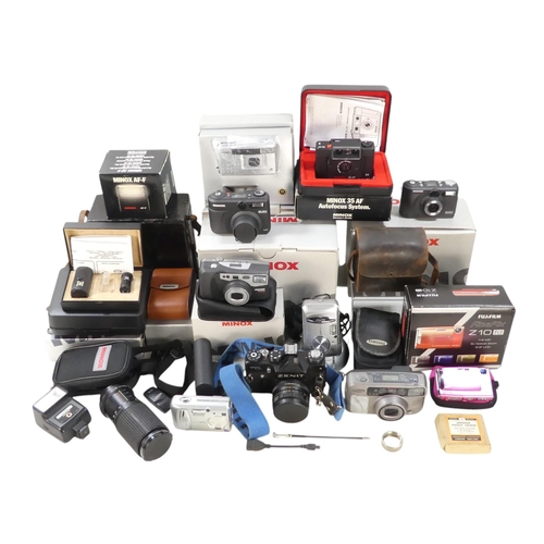 150 - A Minox DC 3311 camera - boxed with accessories, together with a DC2111 also boxed with accessories ... 