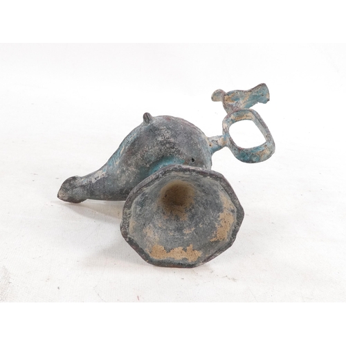 17 - A bronze oil lamp - with bird finials to cover and handle, together with another elephant form oil b... 