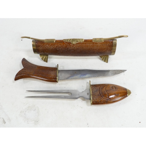 21 - A 20th century Indian carving set - modelled as a fish with brass mounts.