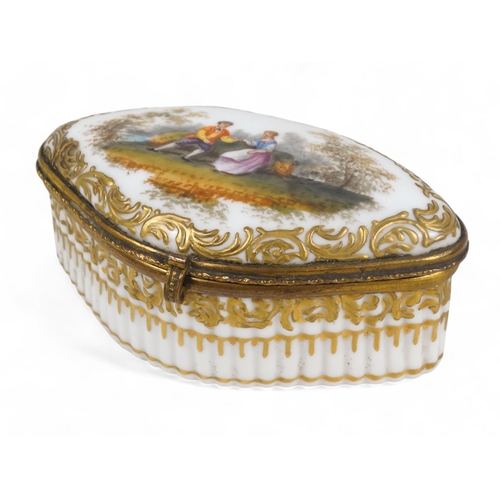 214 - A 19th century Meissen patch box - navette shaped with a ribbed body and a gilt metal interior, 9cm ... 