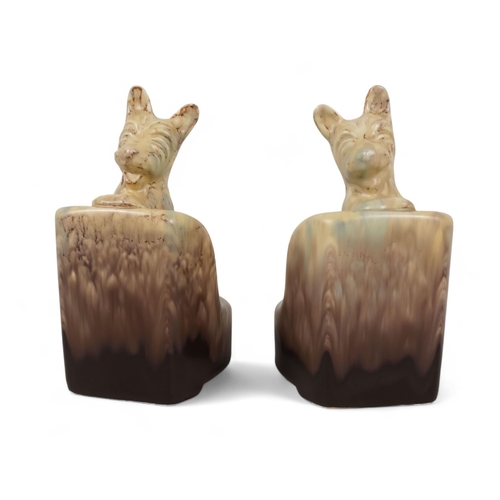 217 - A pair of Beswick bookends - modelled as Scottie dogs with a plum and cream graduated marbled finish... 