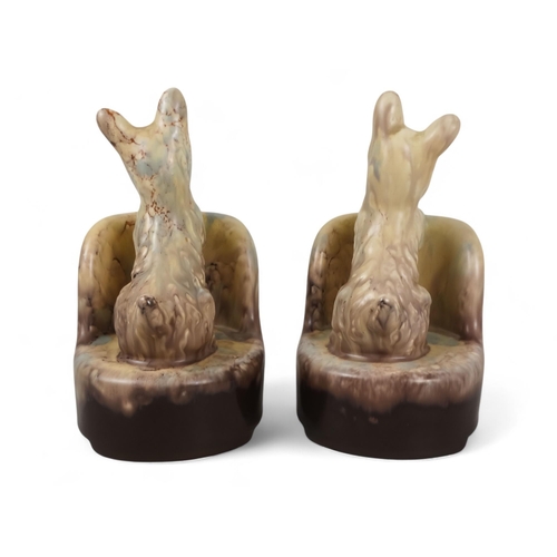 217 - A pair of Beswick bookends - modelled as Scottie dogs with a plum and cream graduated marbled finish... 