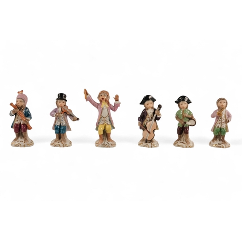 223 - A Sitzendorf Meissen style monkey band - comprising a conductor and eleven musicians, each approx 10... 