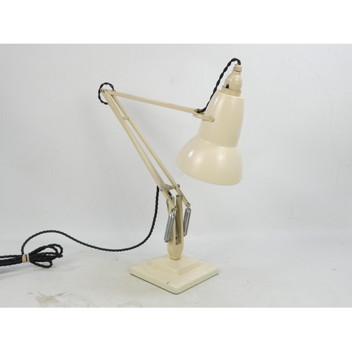 23 - A Herbert Terry Anglepoise lamp - cream painted with a conical bell shade, on a stepped square base.