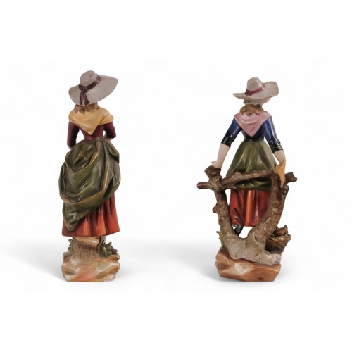 233 - A pair of early 20th century German figures - modelled as peasant girls displaying their wares, 24cm... 