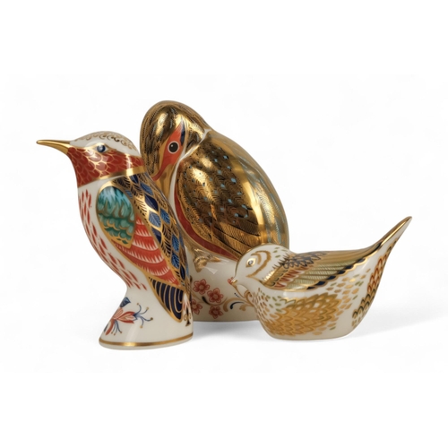 235 - A Royal Crown Derby kingfisher paperweight - perched with a fish, 11cm high, together with two furth... 