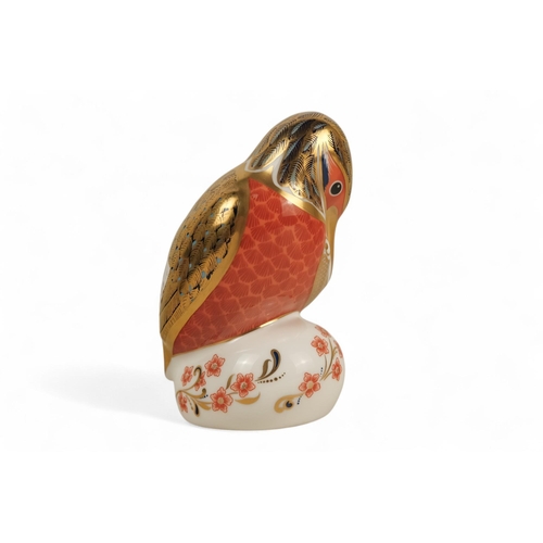 235 - A Royal Crown Derby kingfisher paperweight - perched with a fish, 11cm high, together with two furth... 