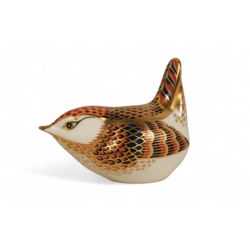 236 - A Royal Crown Derby wren paperweight - 6cm high, together with two further birds. (3)