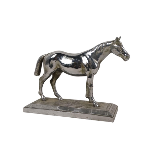 24 - An early 20th century chrome casting of a horse - standing on a rectangular base, 25cm wide.