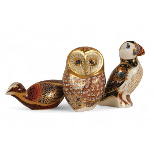 240 - A Royal Crown Derby owl paperweight - 11cm high, together with a puffin and another bird. (3)