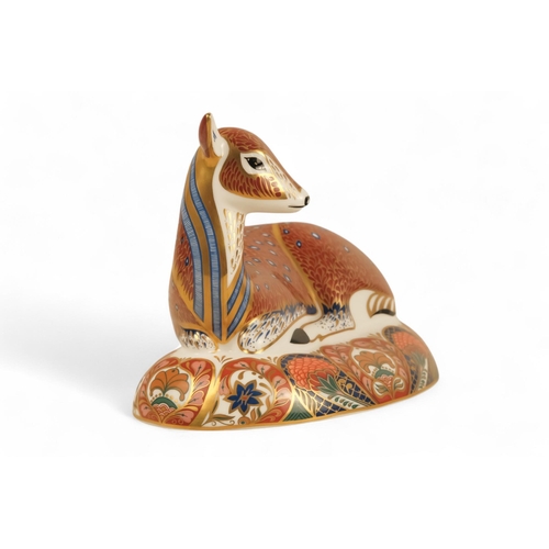 241 - A Royal Crown Derby deer paperweight - in a recumbent pose, 13cm high.