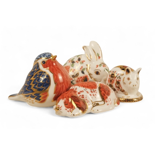 242 - A Royal Crown Derby rabbit paperweight - 7cm high, together with three others in the form of a robin... 