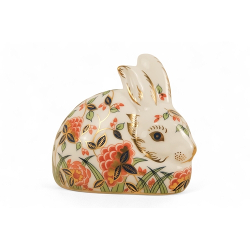 242 - A Royal Crown Derby rabbit paperweight - 7cm high, together with three others in the form of a robin... 