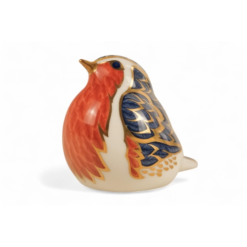 242 - A Royal Crown Derby rabbit paperweight - 7cm high, together with three others in the form of a robin... 