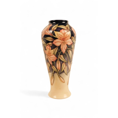 262 - A Moorcroft Pottery vase of baluster form - 'Peruvian Lily' pattern designed by Sian Leeper with tub... 