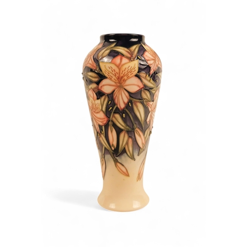 262 - A Moorcroft Pottery vase of baluster form - 'Peruvian Lily' pattern designed by Sian Leeper with tub... 