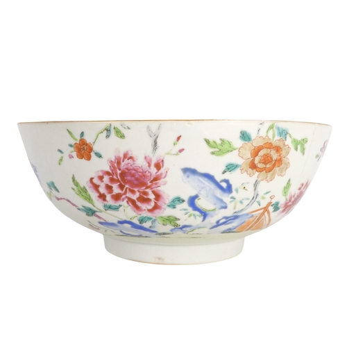 303 - A 19th century Chinese famille verte bowl - decorated in enamels with flowers and a bridge, raised o... 