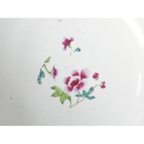 303 - A 19th century Chinese famille verte bowl - decorated in enamels with flowers and a bridge, raised o... 