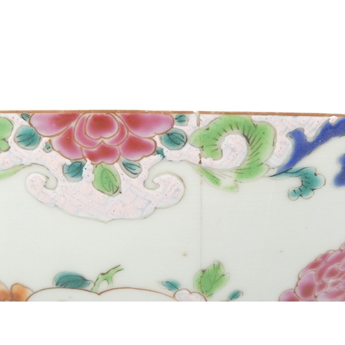 304 - A 19th century Chinese famille verte bowl - decorated in enamels with flowers and a pagoda and with ... 