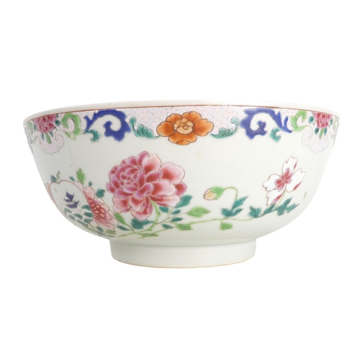 304 - A 19th century Chinese famille verte bowl - decorated in enamels with flowers and a pagoda and with ... 