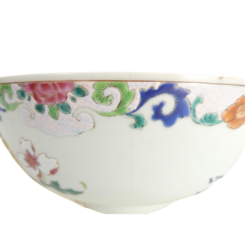 304 - A 19th century Chinese famille verte bowl - decorated in enamels with flowers and a pagoda and with ... 