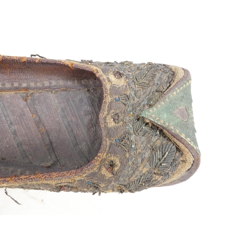 305 - A pair of early 20th century Chinese Manchu platform shoes - the upper with a floral silk design on ... 