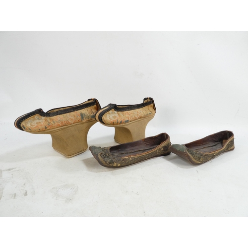 305 - A pair of early 20th century Chinese Manchu platform shoes - the upper with a floral silk design on ... 