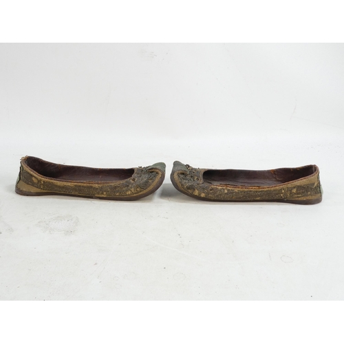 305 - A pair of early 20th century Chinese Manchu platform shoes - the upper with a floral silk design on ... 