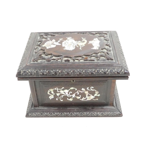 306 - A late 19th century hardwood jewellery box - the hinged cover inset with mother-of-pearl scholar fig... 