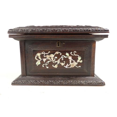 306 - A late 19th century hardwood jewellery box - the hinged cover inset with mother-of-pearl scholar fig... 