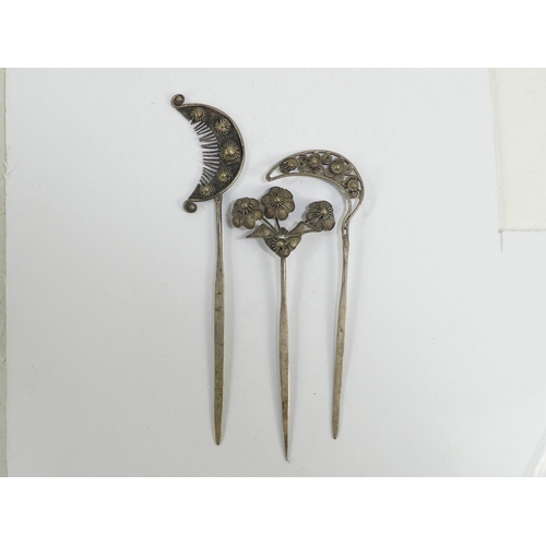 308 - Three various Chinese white metal hair pins - one modelled as blooming flowers, the other two as fol... 